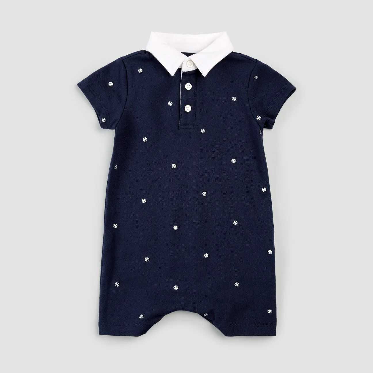 Romper polo bleu marine avec balles de tennis brodées